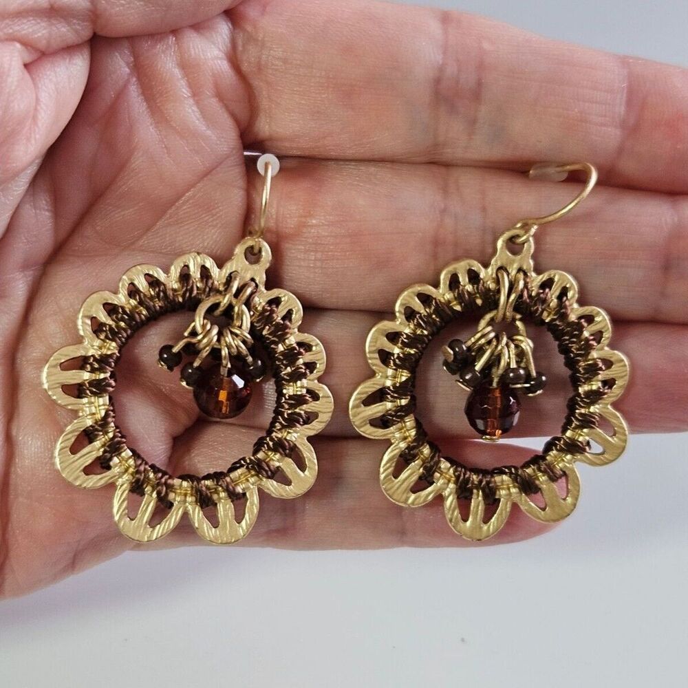 Gold tone circular earrings brown dangling